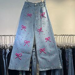 対外貿易のアメリカの重工のビーズの蝶結びのジーパンの女性の春秋の新型の高い腰はやせているゆったりしているズボンの2025夏を現します。