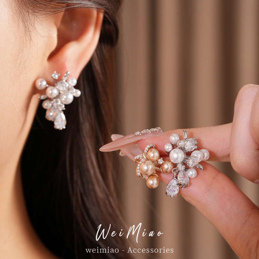 Agujas de plata mariposa gota de piedra aretes de perlas ligeros de lujo de alta calidad pernos diarios temperamento al por mayor auriculares