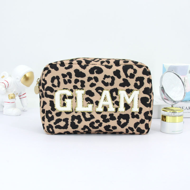 Leopard-print suede cosmetic bag with fashionable letter embroidery, large capacity, portable travel organizer, and stylish handheld design