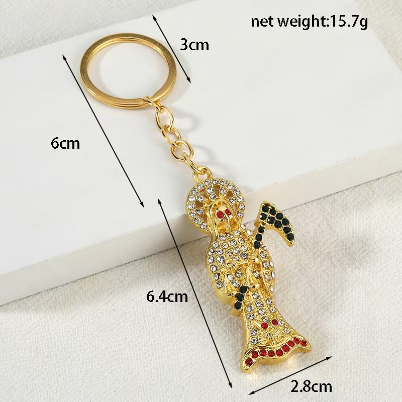 Fuentes transfronterizas de metal accesorios de joyería de diamantes completos llavero colgante collar colgante joyería de calavera de hoz creativa