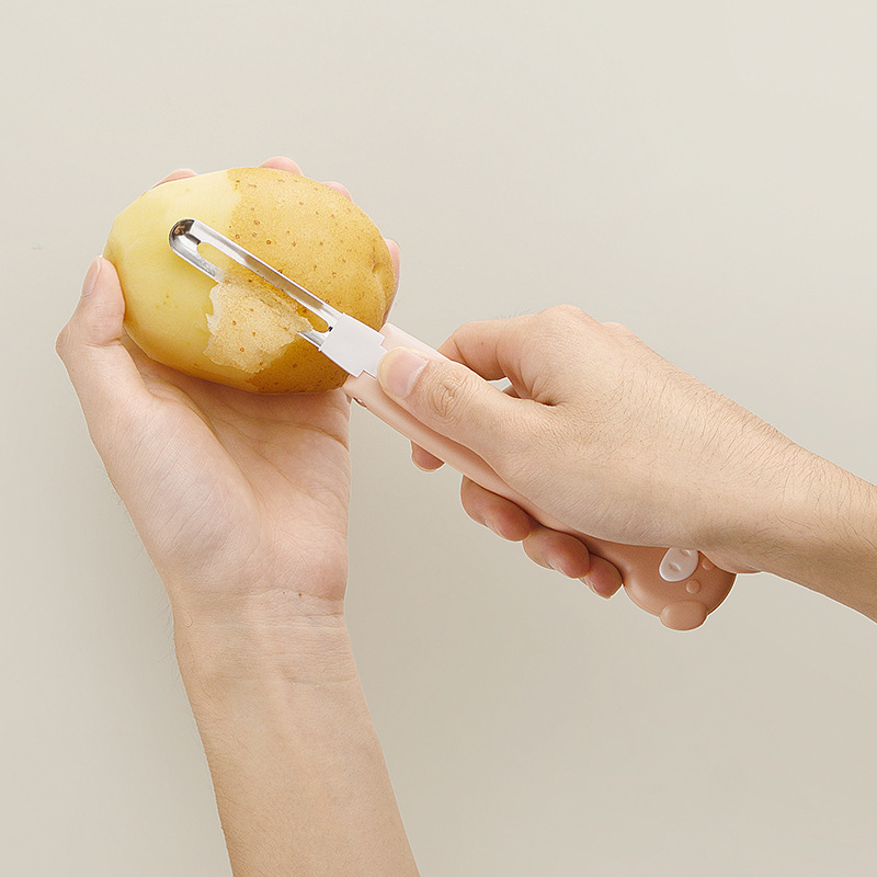 Cuchillo de frutas plegable creativo portátil de melón y frutas para cocina cuchillo de peeling multifuncional dos en uno artefacto mágico