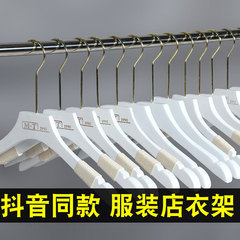洋服屋のハンガーの実の木製の子供の女装の木の白いウェディングドレスの服はズボンを掛けて服を挟んで支えます。