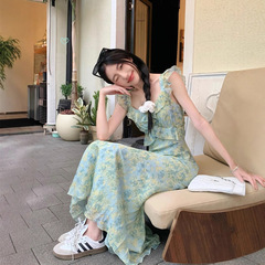 茶休フランスの花のストラップのワンピースの女性の夏の2025新型の修身はやせている海辺の休暇のビーチのロングスカートを現します。