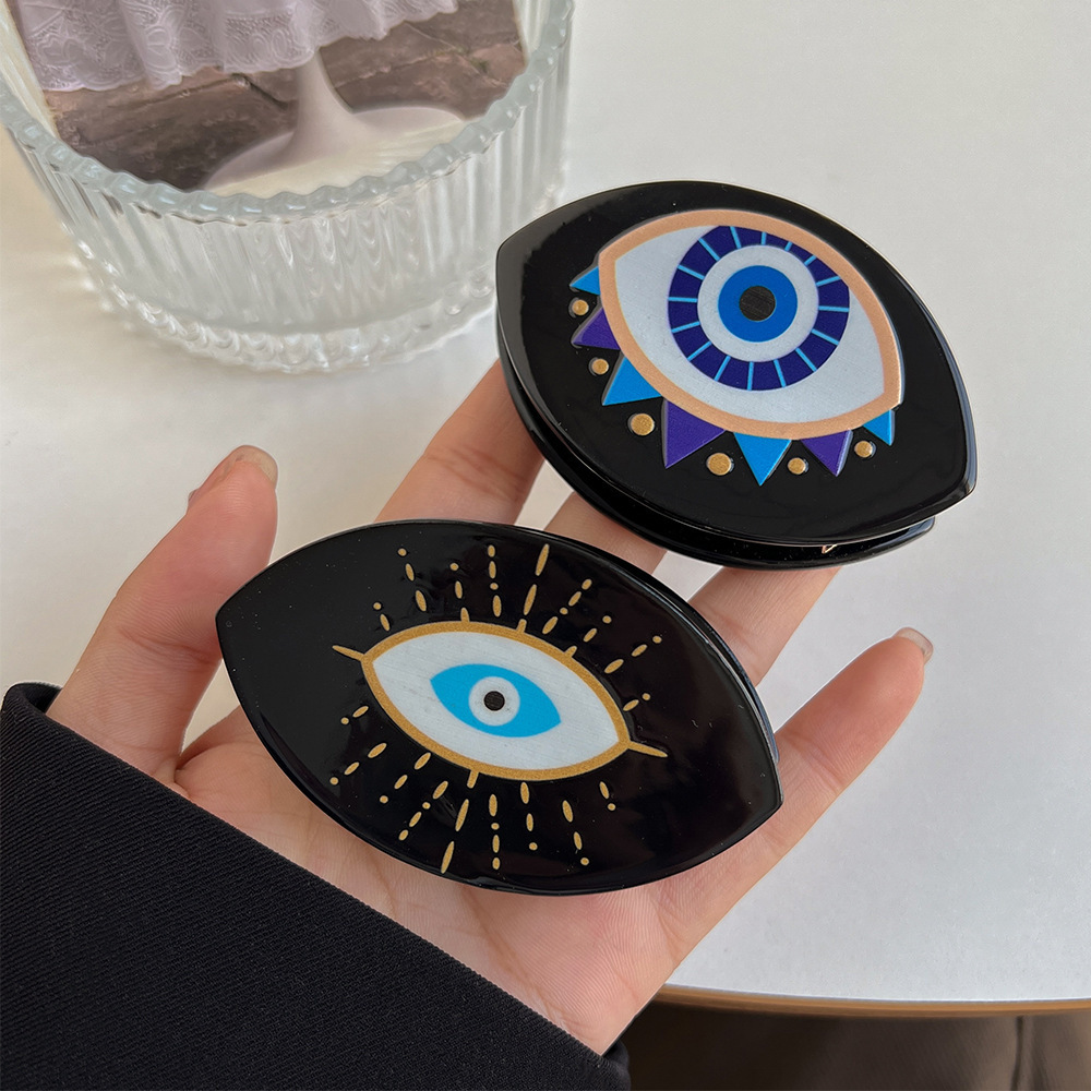 Devil's Lisa's Bright Eye haarclip van acetaat in minimalistische stijl, geschikt als haaraccessoire voor dames._voghion.com