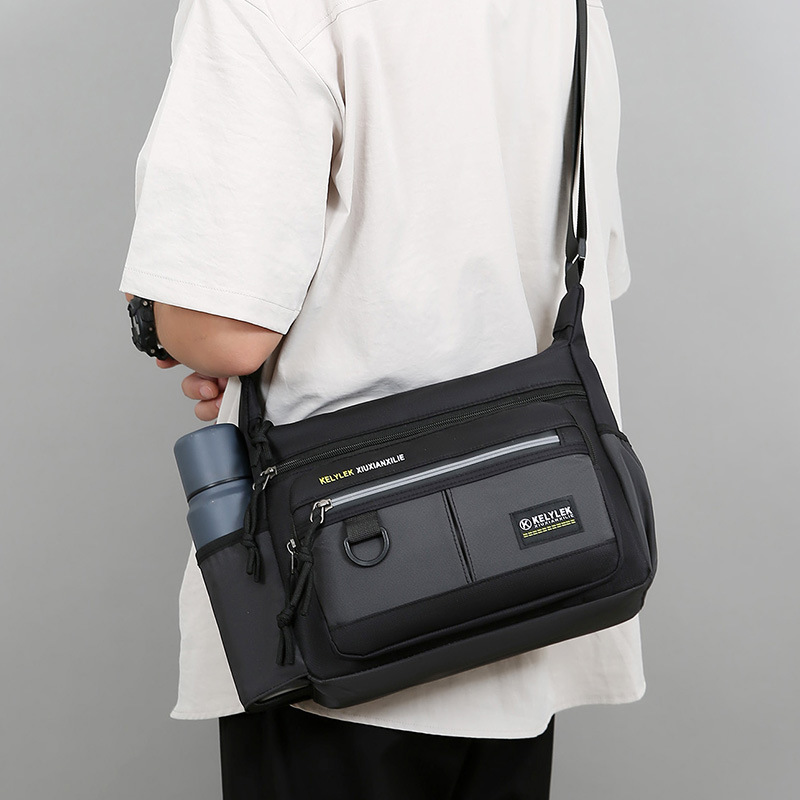 Bolso de hombro casual para hombre de nuevo estilo Bolso de mensajero de almacenamiento de taza de agua multifuncional de gran capacidad Bolso de hombre de negocios de cercanías de moda
