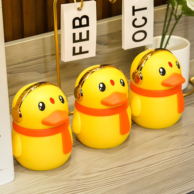 Creativo de dibujos animados lindo moda pequeño pato amarillo de alta gama luz de lujo palillo de dientes puede presionar la señal emergente automática para el hogar