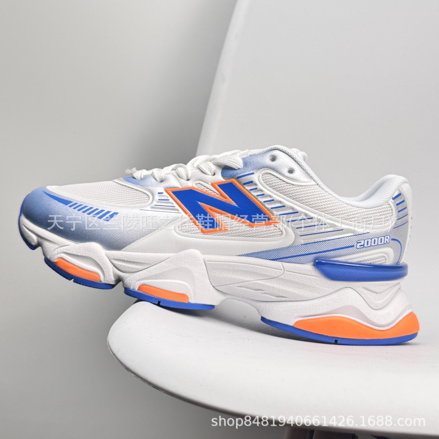 Putian NB M2000 serie de moda versátil tela de cuero artificial de cerdo amortiguador antideslizante desgaste zapatillas de correr bajas