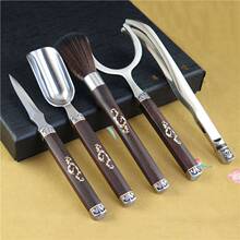 淘瓷八不锈钢茶杯叉茶具配件 血檀双色柄盾牌防烫杯托厂家