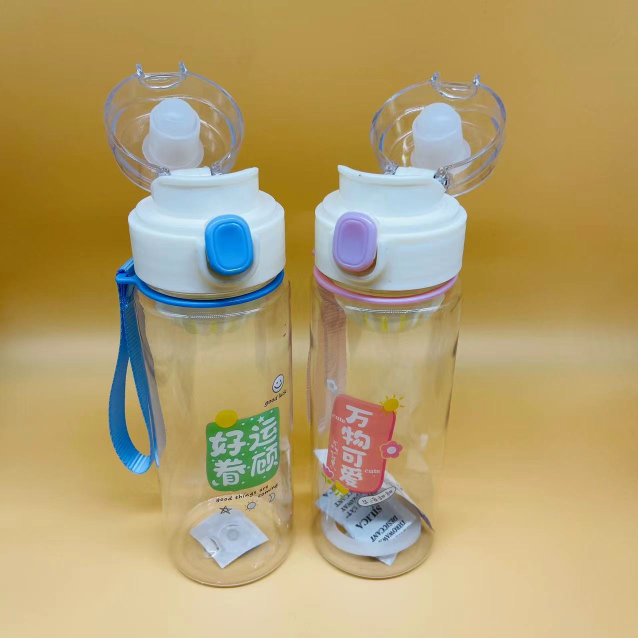 Cubierta de rebote estudiante pequeña capacidad deportes portátil 600ml té perfumado taza portátil rebote taza de agua de plástico con mango