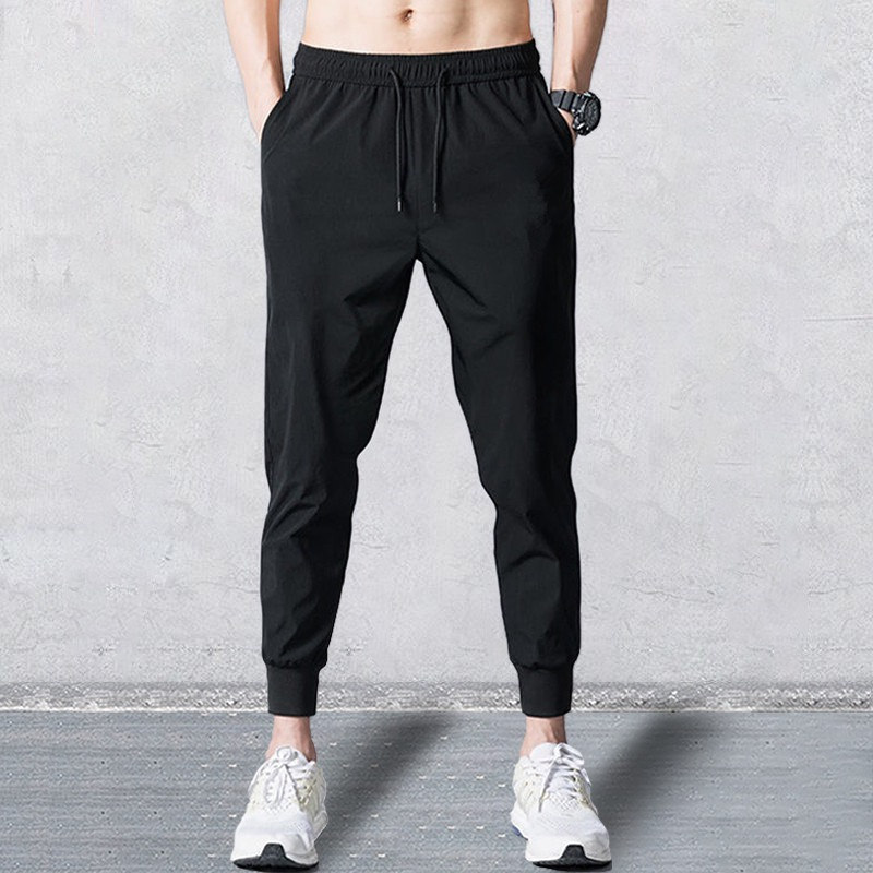 Otoño e Invierno forrado de lana caliente pantalones de chándal atados al tobillo negro y gris bordado de costura de moda casual sueltos Deportes de los hombres Pantalones