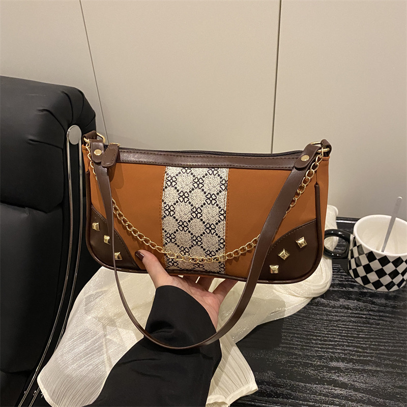 Bolso de mujer 2025 primavera nueva moda retro esmerilado empalme bolso de color contraste bolso de mujer un hombro brazo bolso de moda