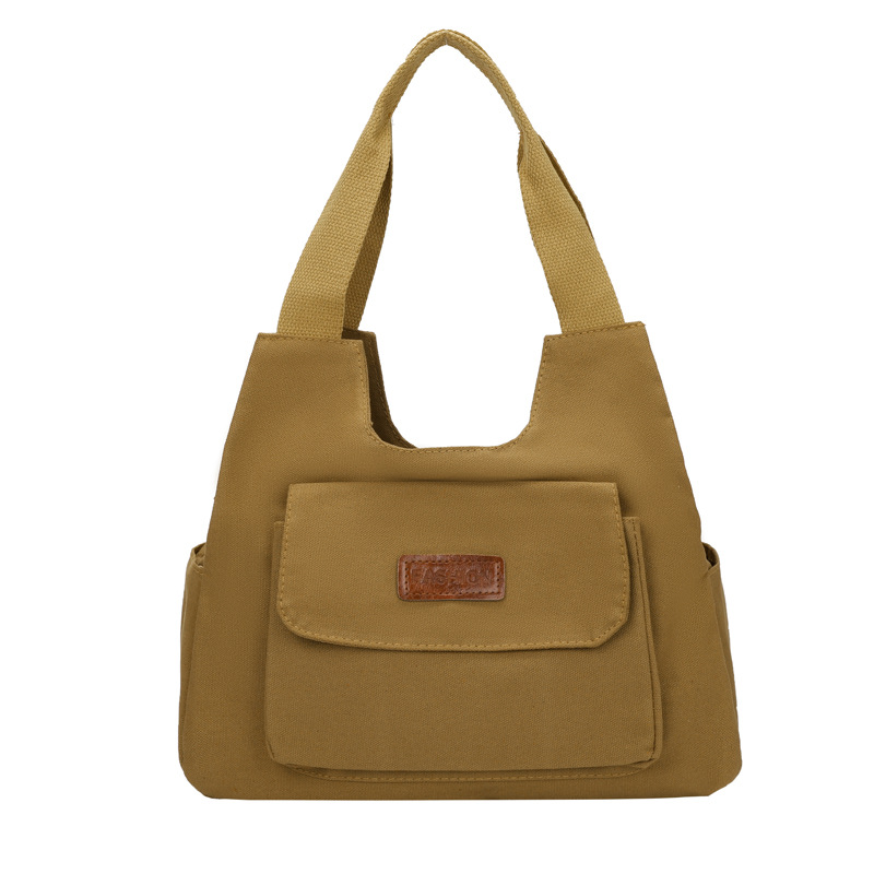 2024 invierno nuevo paquete de viaje japonés retro nicho sensación de diseño bolso de lona simple color sólido bolso casual