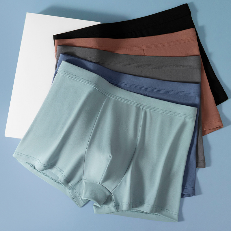 Pantalones interiores de hombre de cintura media de color sólido antibacteriano respirable piel cómoda pantalones planos fabricantes de hombres al por mayor