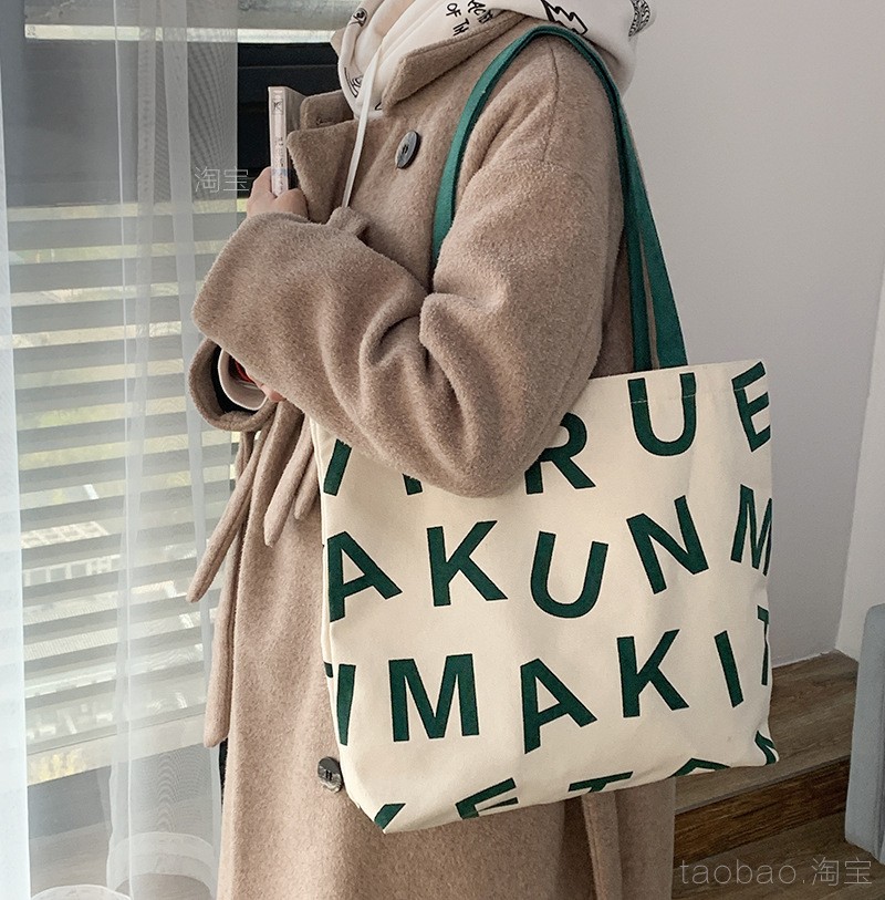 Bolsa de compras de lona de gran capacidad estilo europeo nuevo 2025 estilo ins perezoso para mujer, bolso de hombro para estudiantes, literario y simple.