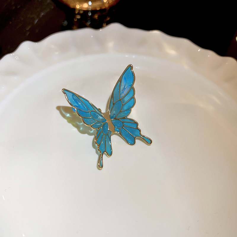 Pinzas para las orejas de aceite de goteo de mariposa súper hada sin orejas pinzas para las orejas de temperamento dulce y de moda, pendientes de personalidad fresca y de todo fósforo al por mayor