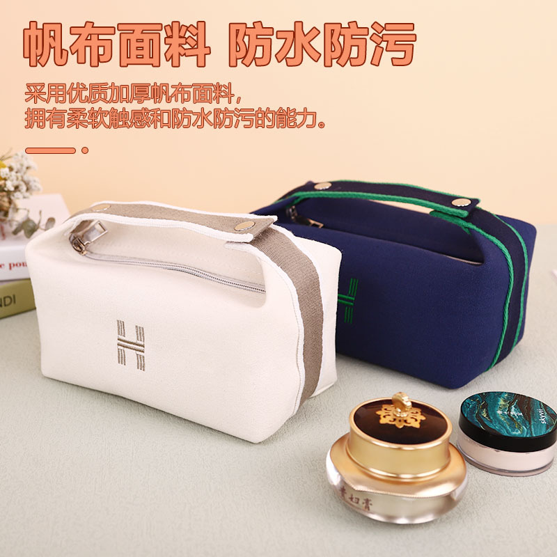 Bolsa de cosméticos de lona impermeable portátil de alta apariencia de gran capacidad de lavado bolsa de cosméticos de red roja portátil bolsa de almacenamiento de color sólido