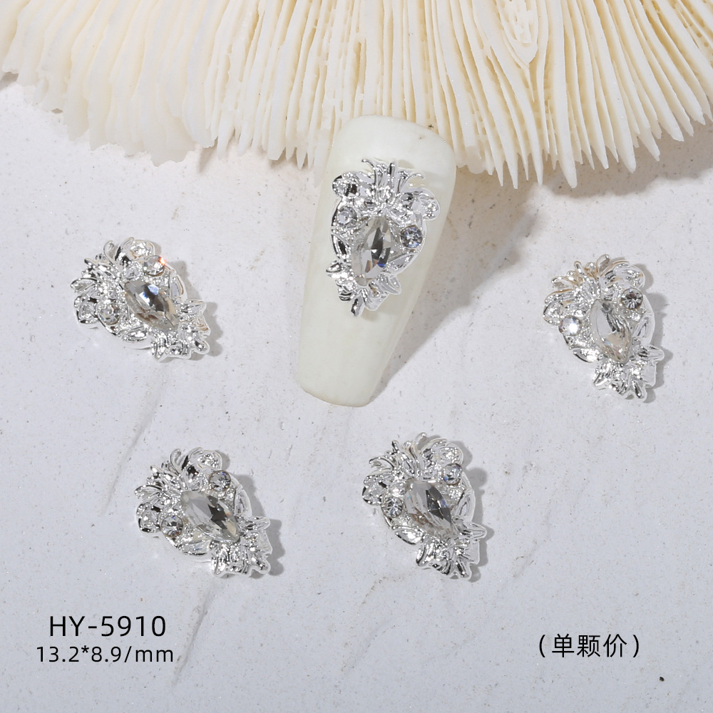 Venta caliente taladro de uñas arco de plata joyería tridimensional flash diamante esmalte de uñas decorativo diamante acabado pieza de uñas traje de joyería