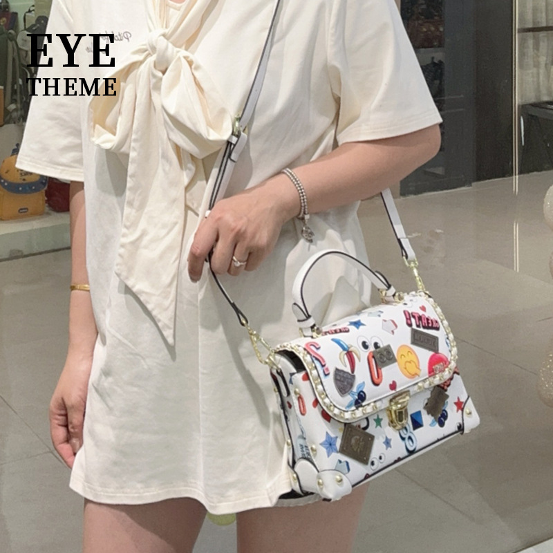 2025 impresión de moda estampada caja de bolsas con tapa flip insignia de hardware animado bloqueo camiseta alta sensación 2794 #