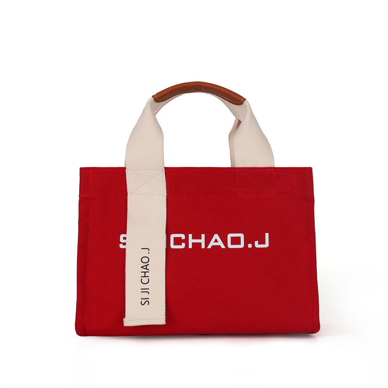 Bolsa personalizada al por mayor, bolso de mano retro de moda, estilo coreano nuevo, bolso de mano con letras impresas en color sólido para mujer