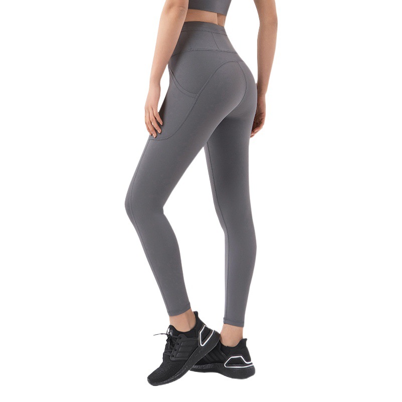 2022 bolsillo lateral desnudo apretado yoga pantalones de las mujeres de Europa y América cintura alta cadera elevación melocotón cadera deportes fitness Pantalones