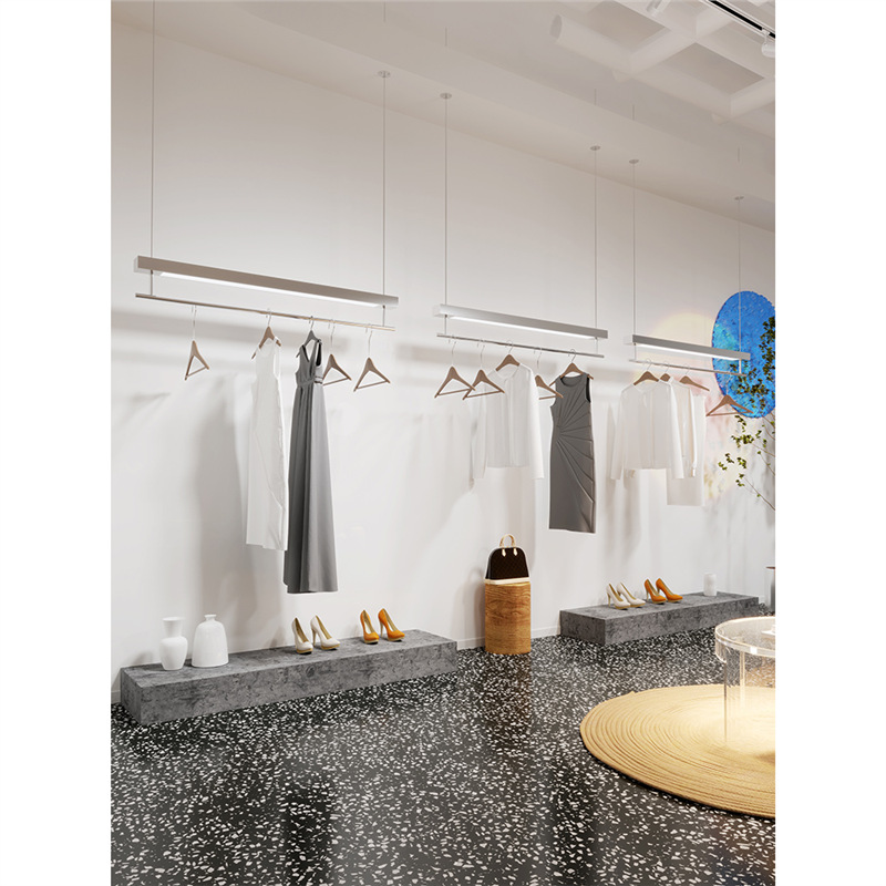 Clothing store display rack on wall hanging ceiling hanging…