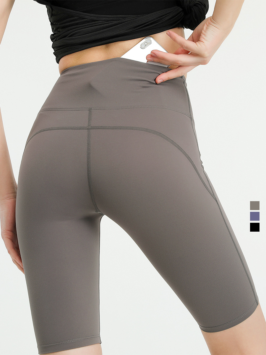Pantalones de yoga transfronterizos europeos y americanos de cintura alta con efecto levanta glúteos y bolsillos para mujer, shorts deportivos elásticos transpirables de secado rápido y ajuste ceñido.