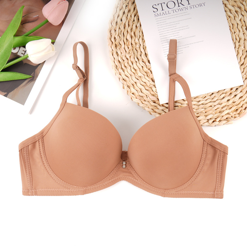 Fábrica de stock de ropa interior lisa sin marcas de pecho pequeño damas juntas sujetador de ajuste de soporte de la niñez sujetador del sudeste asiático