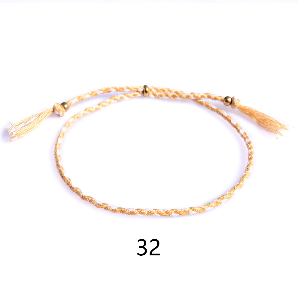 Amazon popular colorido cuerda de algodón amistad pulsera perlas de cobre borla pulsera tejida a mano ajustable hombres y mujeres pulsera
