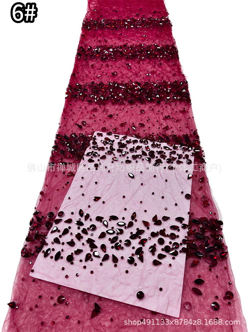 Tejido de malla de diamante de gota de agua laminada mano pesada clavos taladro de cola de pescado vestido de noche tela de boda en stock