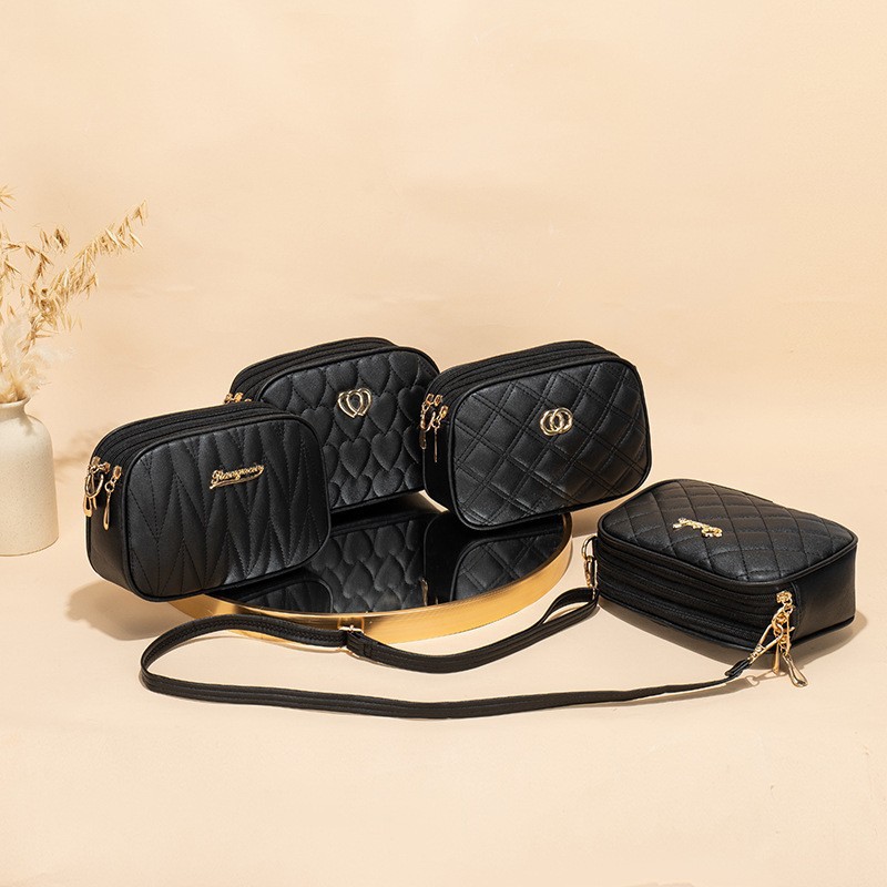 Gran capacidad de tres cremallera mochila 2024 nueva moda simple en forma de V diamante corazón bordado monocromático bolsa de cámara