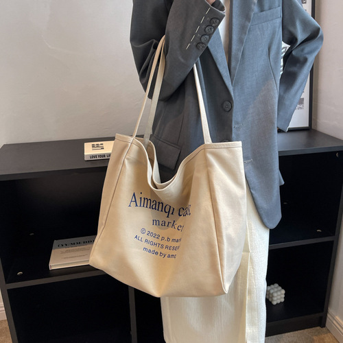 Canvas bag women's large capacity 2024 new versatile shoulder bag cloth bag college student class bag commuter tote bag