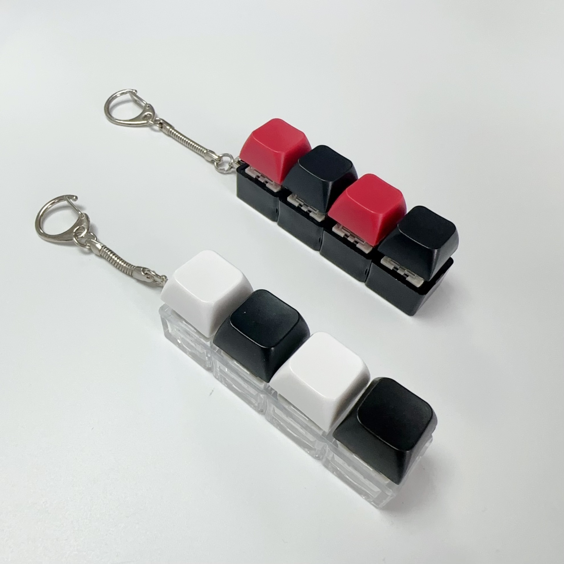 Four-button (black shell-red and black+transparent shell-white and black) set