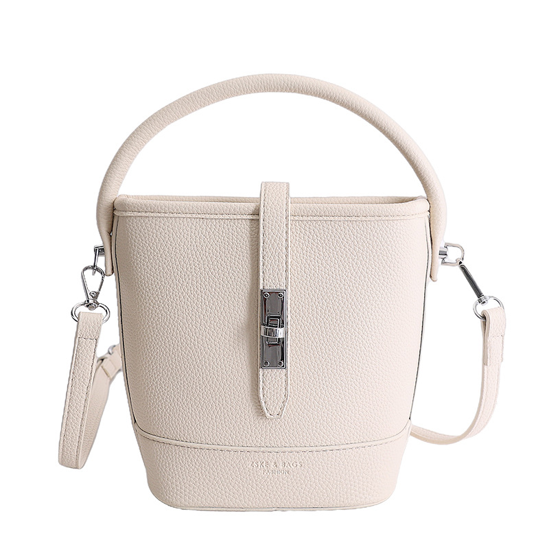 Litchi estampado bolso de cubo de mano mujer 2026 venta caliente nueva moda coreana alta textura mochila de hombro