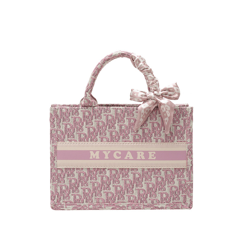 Bolsos bordados de alta calidad para mujeres 2026 nuevas letras de tela transfronterizas retro bolsas de mano de transporte de gran capacidad
