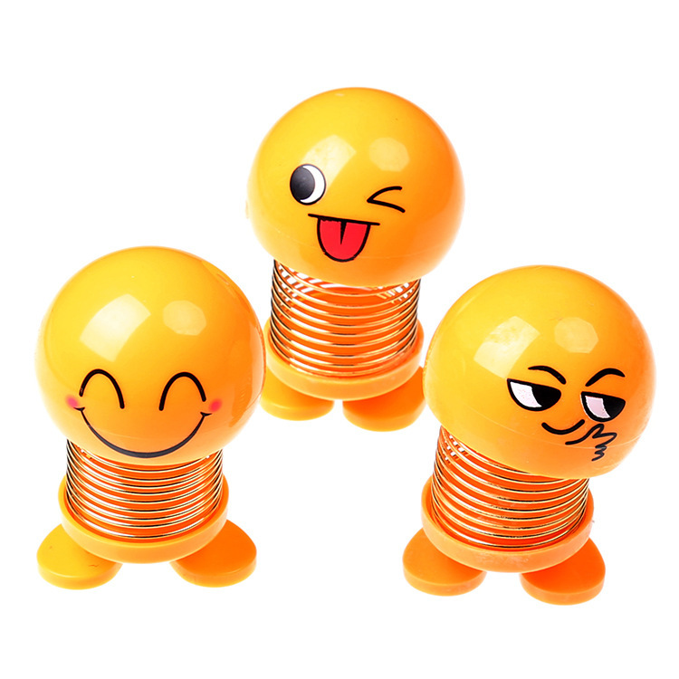 Tiktok mismo estilo sacudiendo cabeza expresión facial bolsa muñeca personalidad creativa Smiley cara coche primavera estudiante Escuela Primaria Decoración