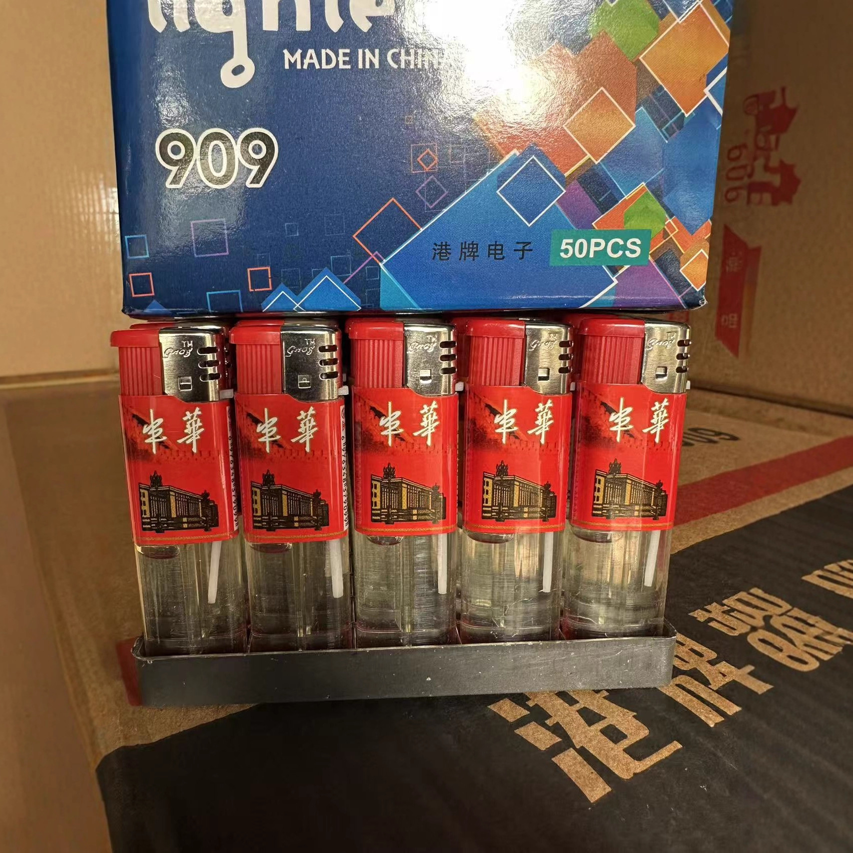 新品港牌909透明明火打火机 厂家销售国际商贸城一次性半包打火机
