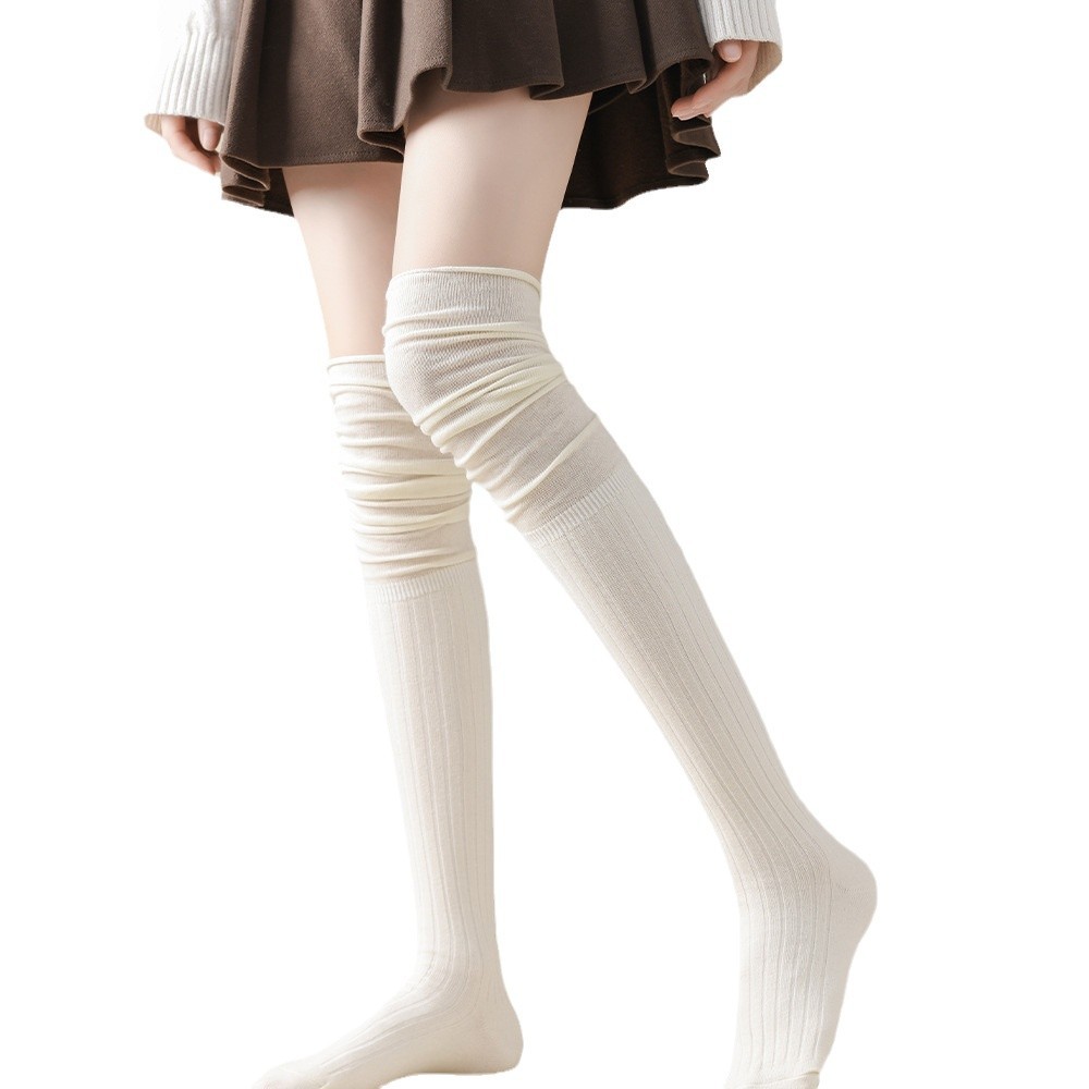 アングラの赤い櫛の綿の長い筒は膝の靴下の高い筒の純色のつなぎ合わせのinsの潮は妊婦の太ももの靴下に乗ります。