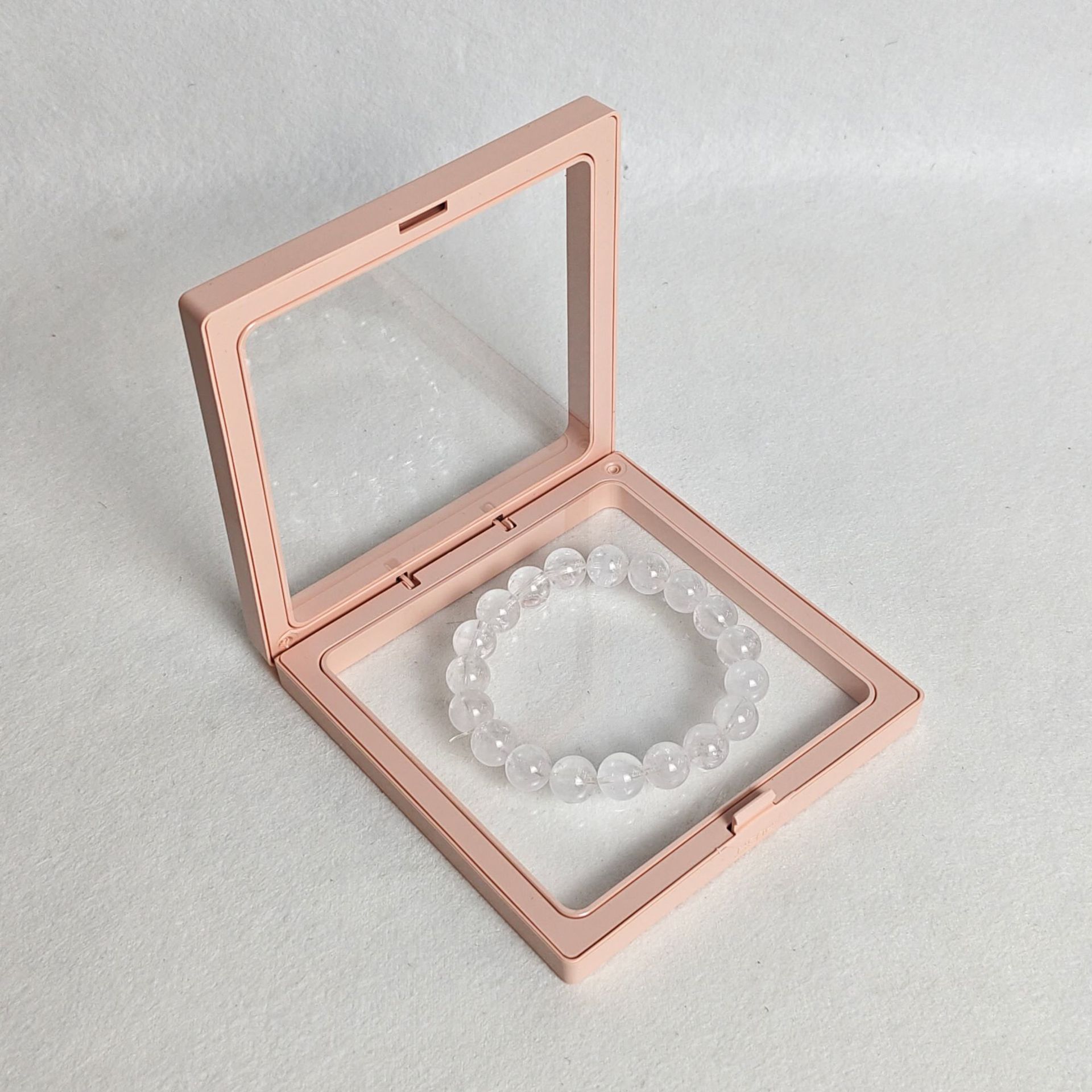 Pink pe membrane box; length and width 9*9cm, thickness 2cm