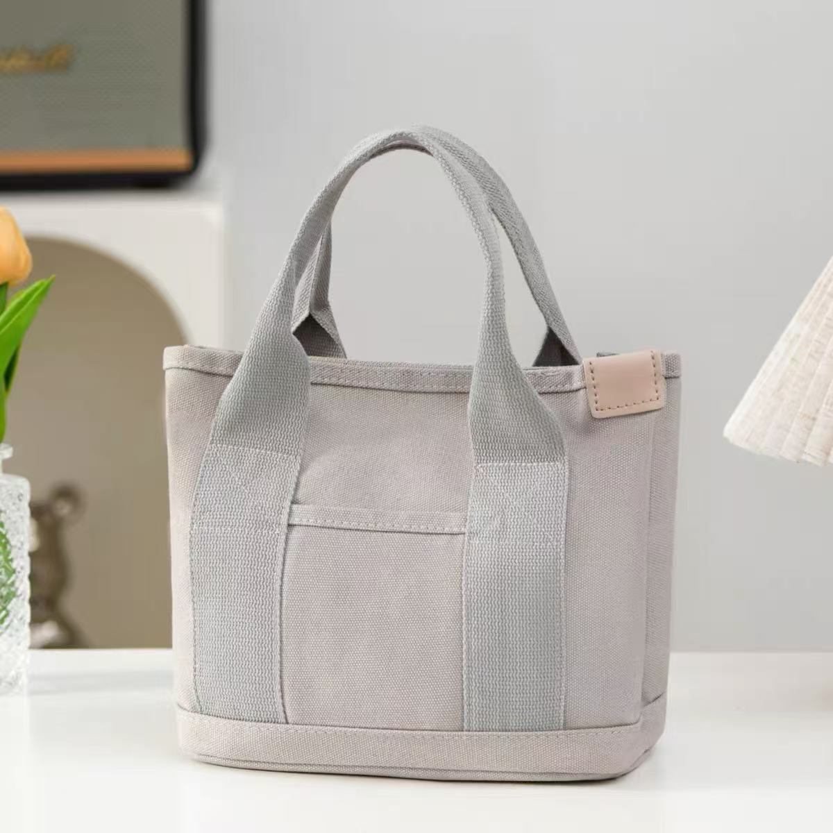 高颜値新型日系キャンバスバッグファッションシンプル大容量手提げ袋日常通勤多目的弁当バッグ女