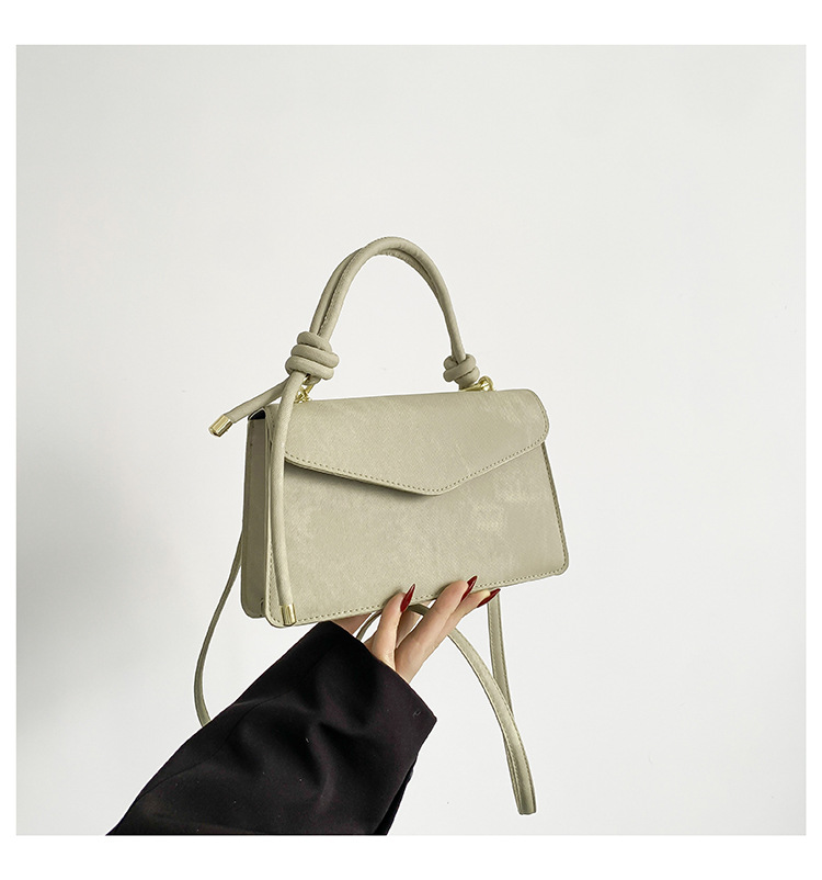 Neto rojo Joker tendencia de color sólido bolso simple bolso de las mujeres 2024 Invierno nuevo bolso cuadrado pequeño oblicuo Cruz Portátil Bolsa de costura del coche