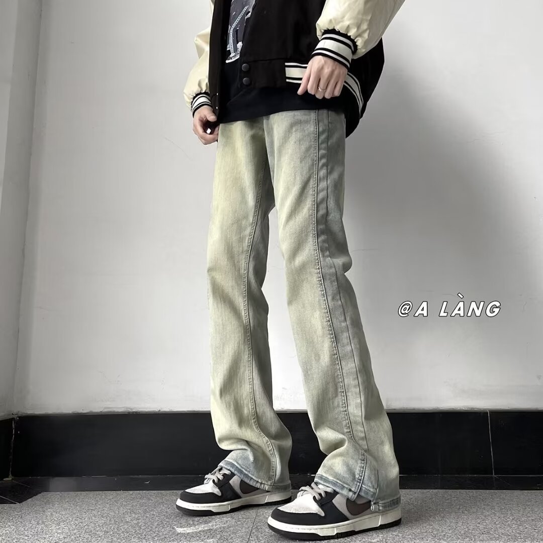 Primavera y verano lavados y desgastados pantalones vaqueros delgados de barro amarillo, pies pequeños de moda para hombres, pantalones de calle americanos 2024