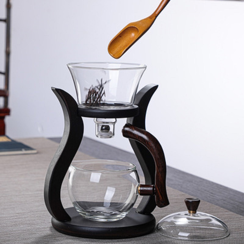 Fábrica al por mayor Palacio lámpara juego de té de vidrio borosilicato fabricante de té perezoso Kung Fu juego de té traje de succión magnética juego de té