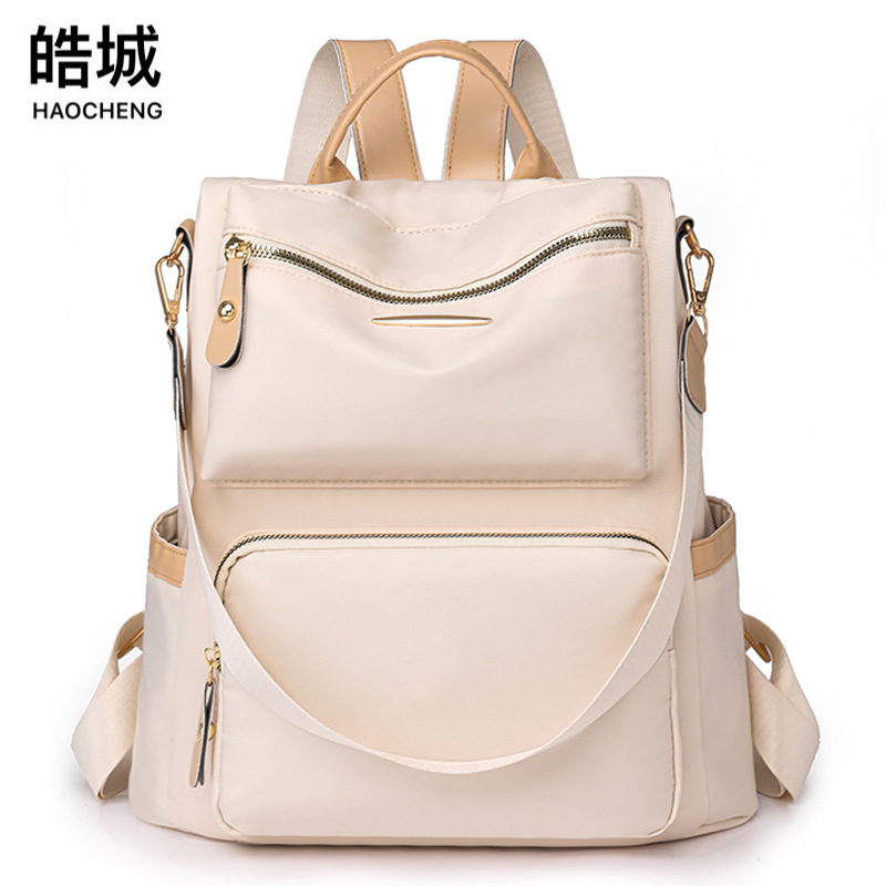 Mochila antirrobo para mujer 2025 primavera nuevo estilo color de contraste mochila para mujer moda viajero multifunción mochila de doble uso