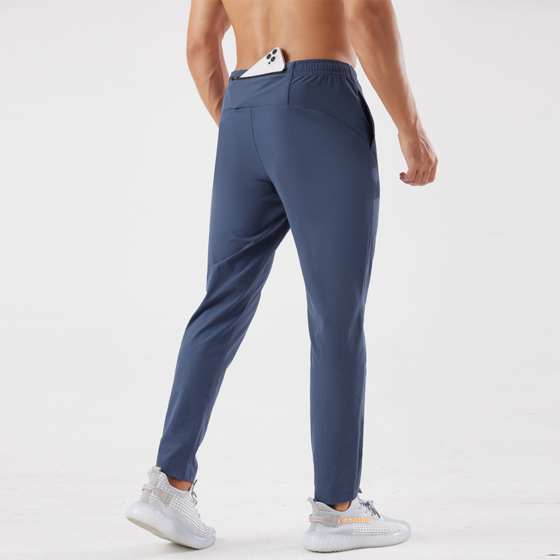 Pantalones deportivos al aire libre Otoño e Invierno hombres corriendo fitness pantalones de secado rápido sueltos transpirables deportes casuales pantalones de entrenamiento de secado rápido