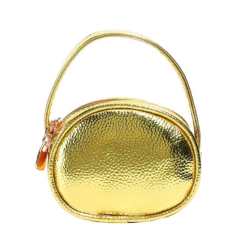 Bolso de mano de niña láser brillante simple color sólido mini bolso de cambio de bebé coreano nuevo bolso infantil transfronterizo