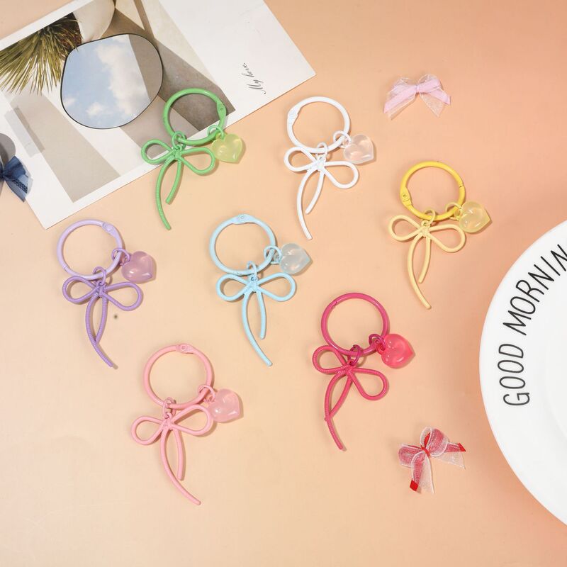 Dopamine hollow bow spray-painted keychain zinc alloy ribbon beaded pendant DIY accessory decoration Dopamine hollow bow spray-painted keychain zinc alloy ribbon beaded pendant DIY accessory decoration