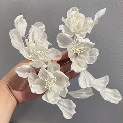 ヘラの新型オリジナルのシンプルで甘い布芸の手作りのアイロン掛けの白い日常旅行のロケ地の結婚の新婦の頭飾り