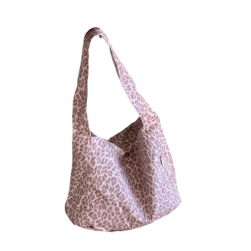 Bolsa de lona portátil, nuevo estilo coreano de patrón de leopardo, nicho casual, bolso de hombro de gran capacidad.