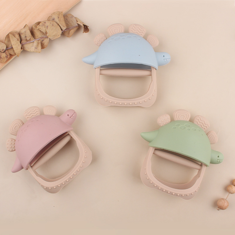 Nuevos guantes de mordedor de dinosaurio de silicona anti-comer para bebés