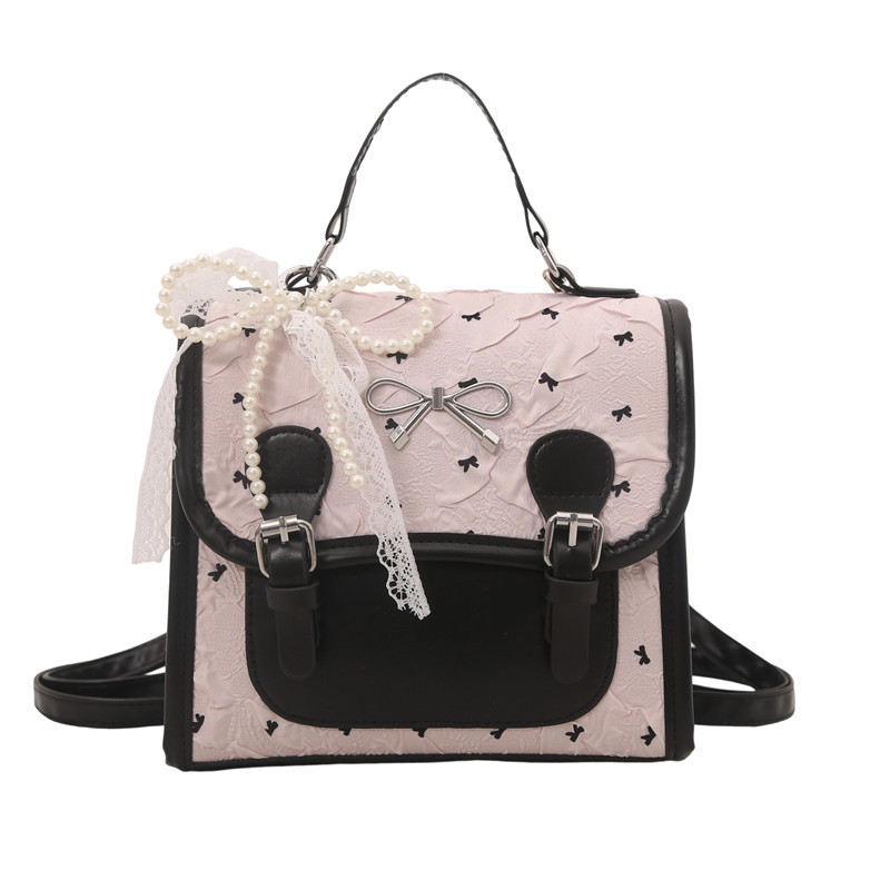 Escuela de viento impresión de arco mochila pequeña mujer verano 2025 nueva moda coreana estilo exterior mochila de viaje ocio